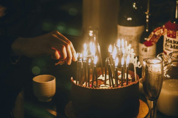 lighted candles on black table